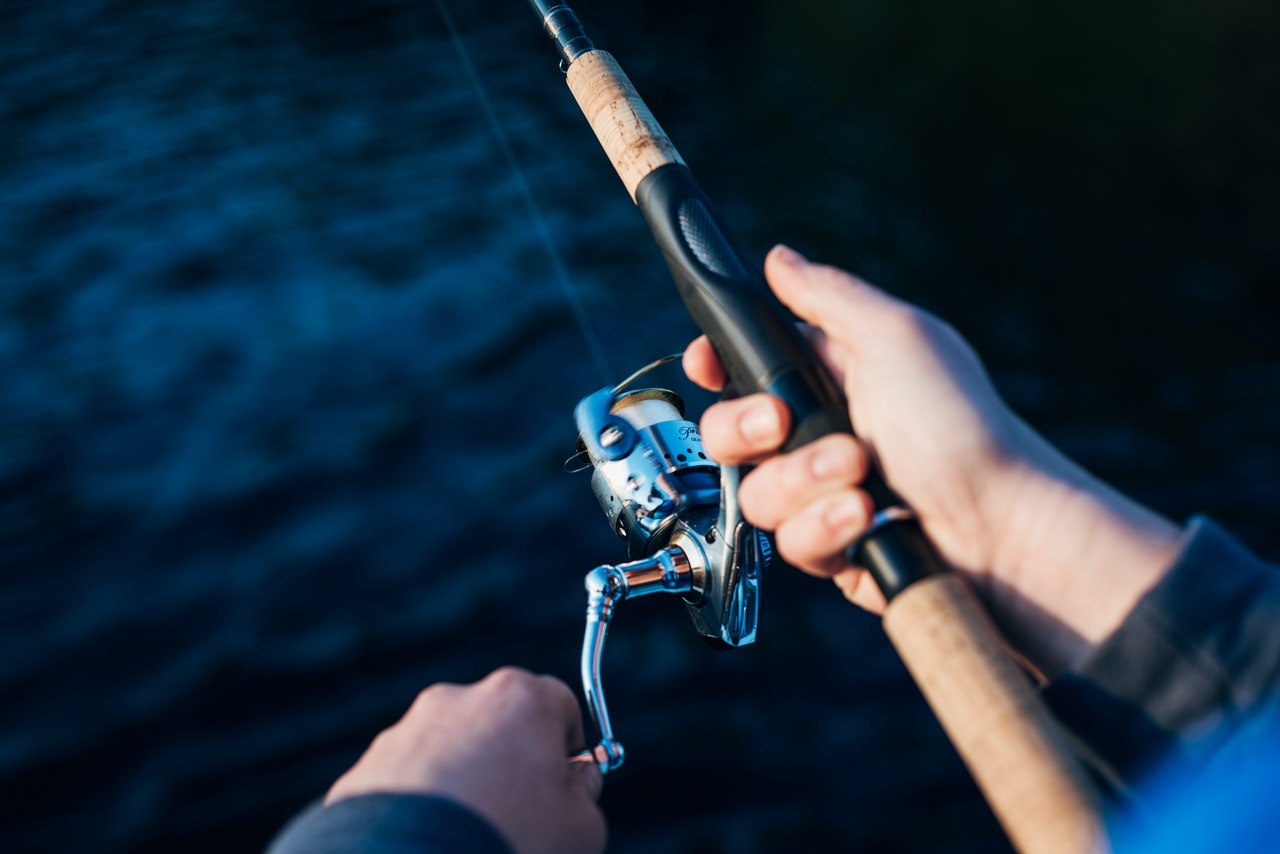 photo-of-person-holding-fishing-rod-2473502