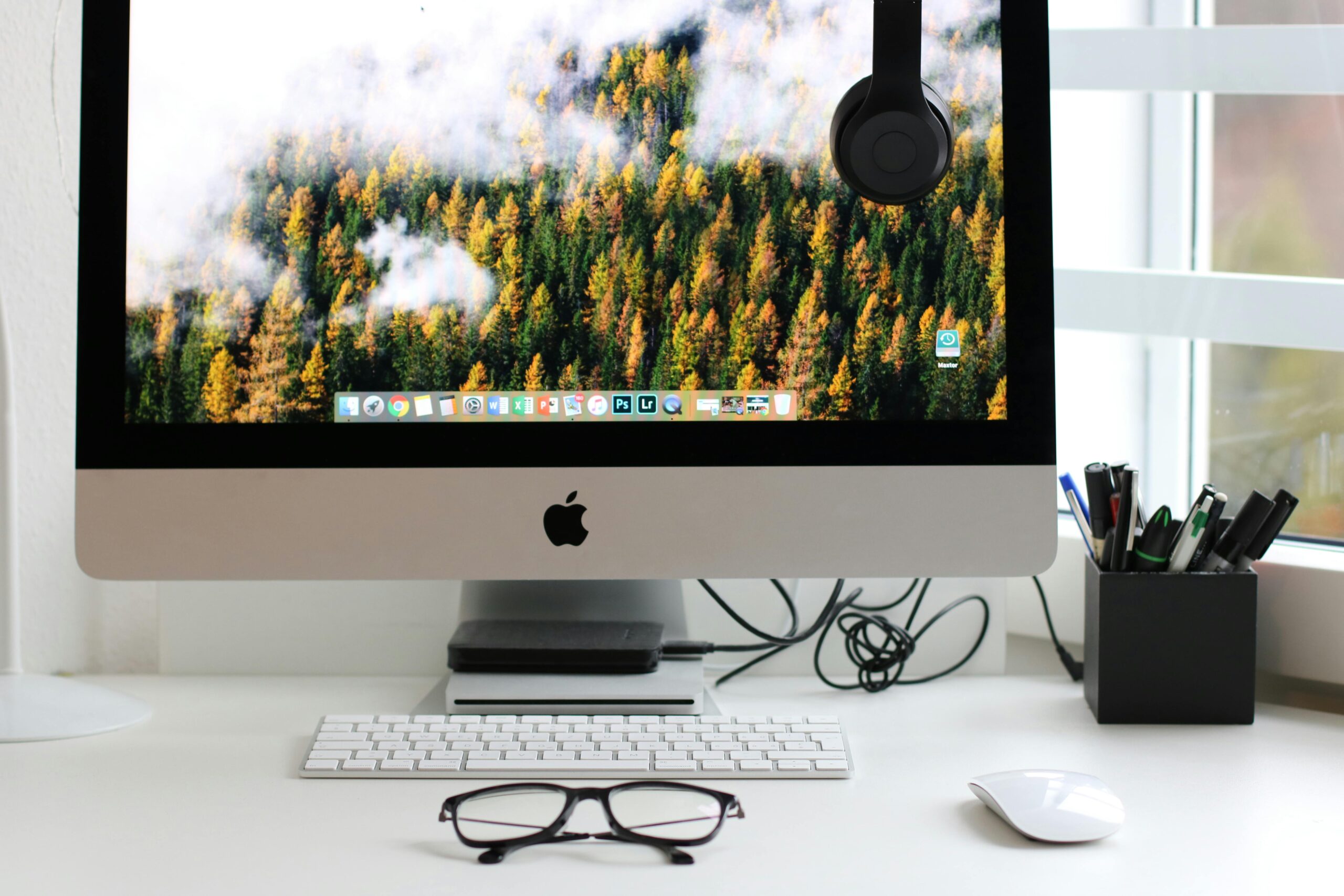10-Awesome-Ways-To-Customize-Your-Desktop-Layout-scaledjpg Free Stylish home office workspace featuring a computer setup with accessories. Stock Photo