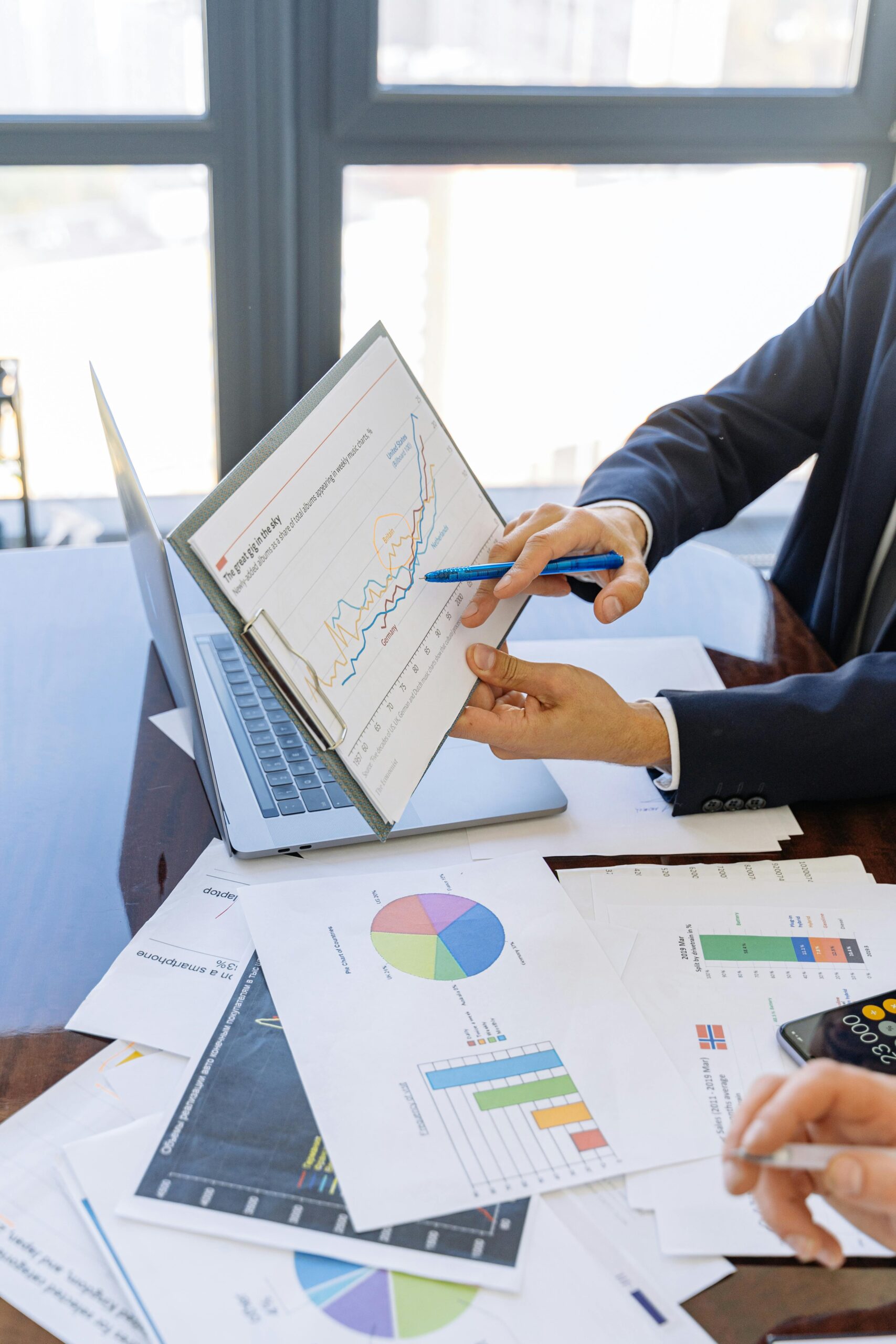 Data-Quality-is-Your-Small-Businesss-Secret-Weapon-scaledjpg Free Business professionals discussing financial graphs and charts in an office setting. Stock Photo